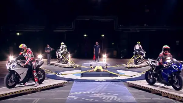 Video: World’s Strongest Man competitor restrains four motorcycles in nail biting record attempt